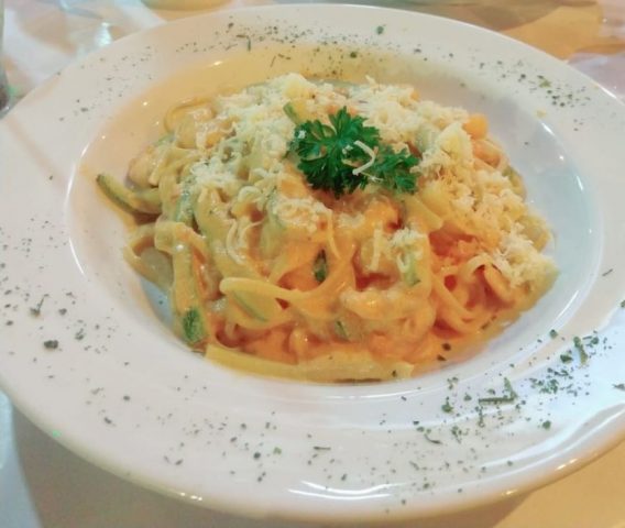 A plate of creamy pasta from a restaurant in Buzios called La Dolce Vita