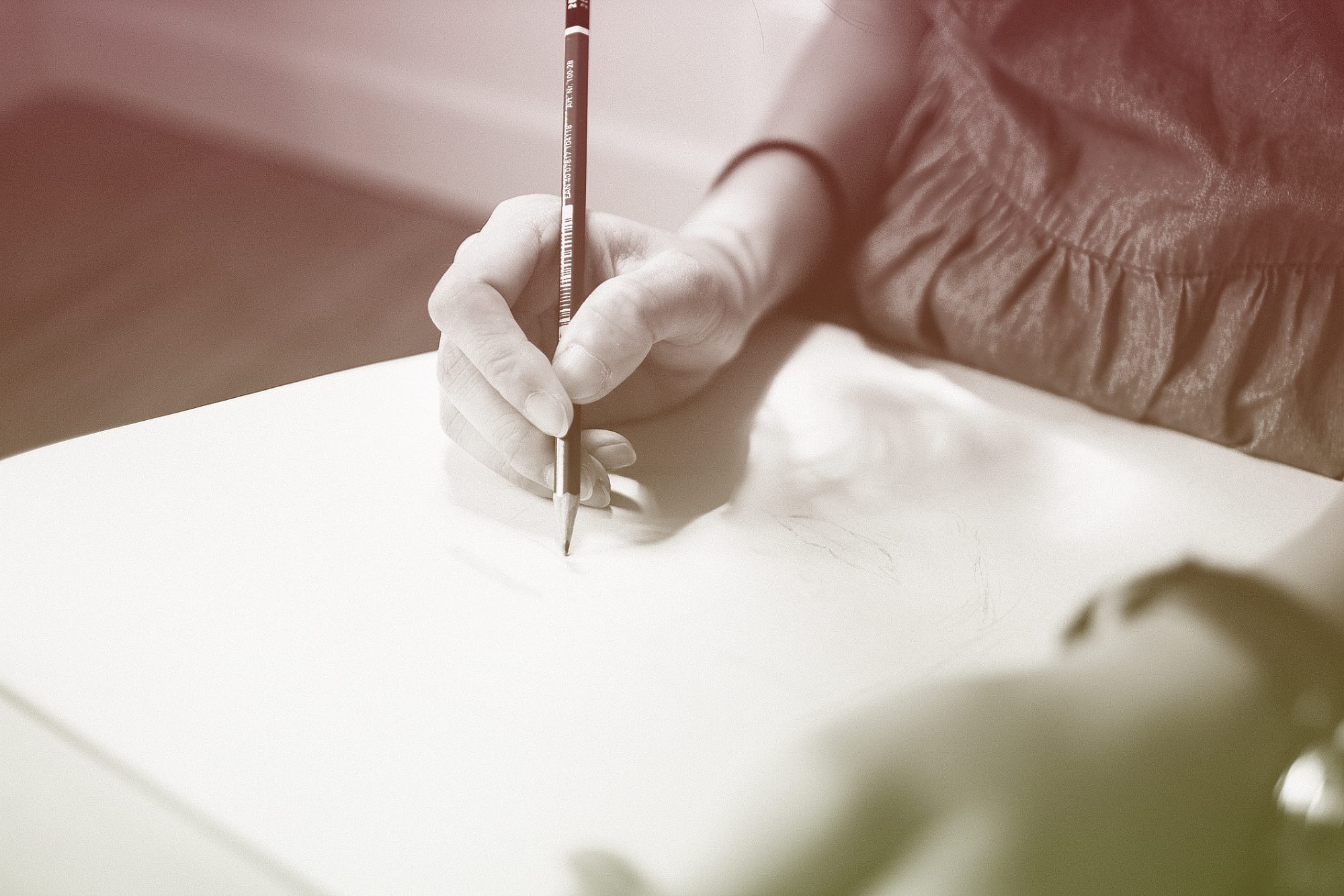 midsection of woman drawing on paper