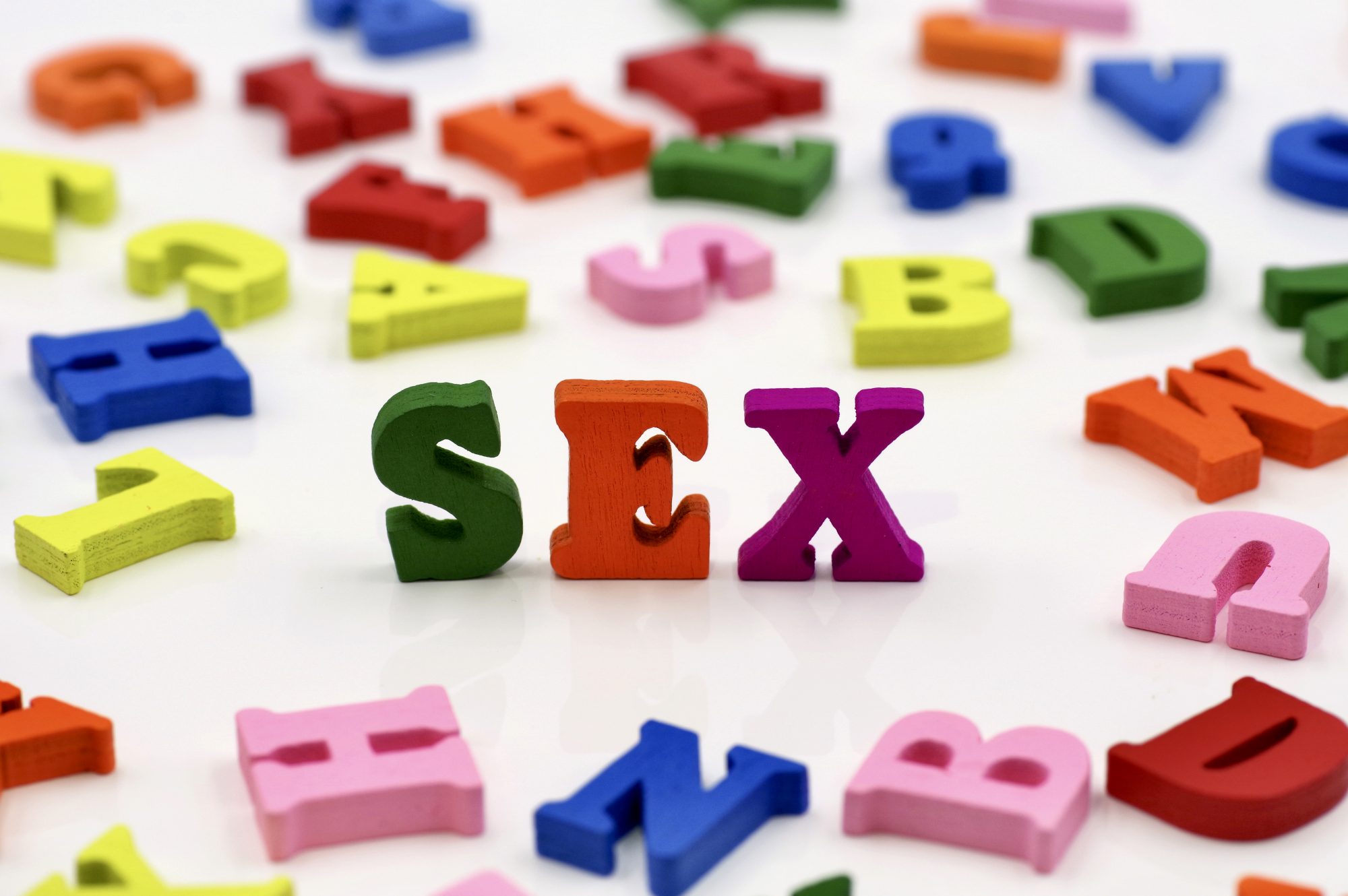 An image of wooden letters spelling out the word "sex."