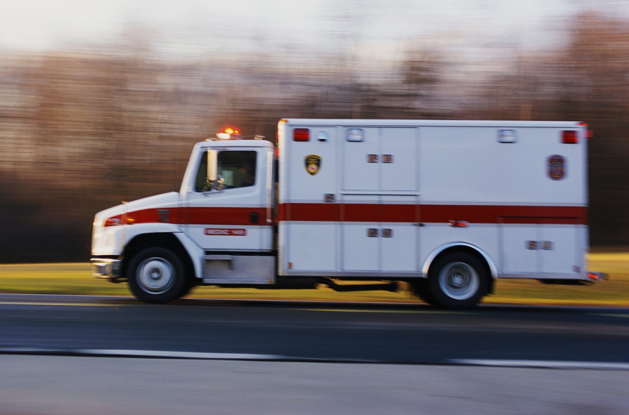An image of an ambulance on a road.