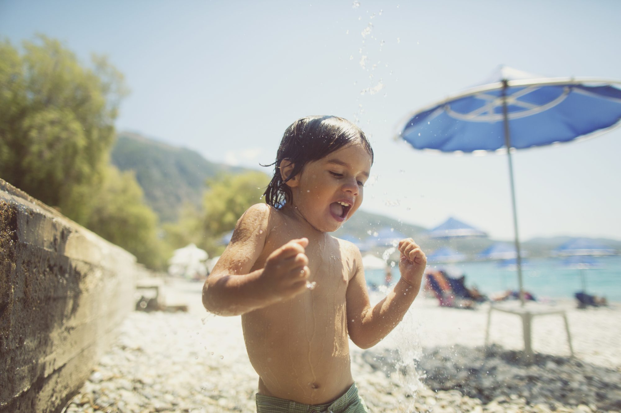 An image of a boy on a beach.