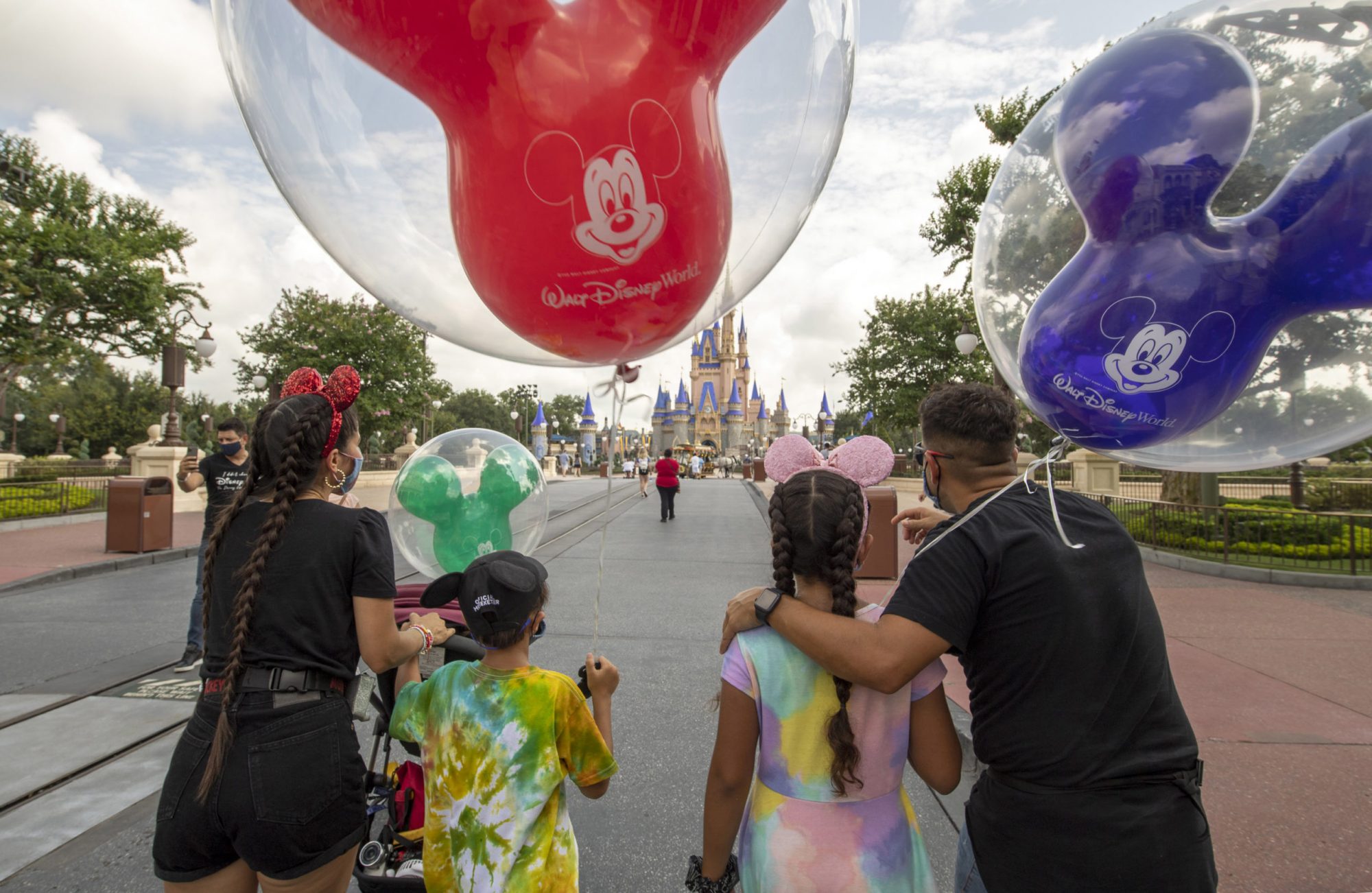 An image of a family going into Walt Disney World.