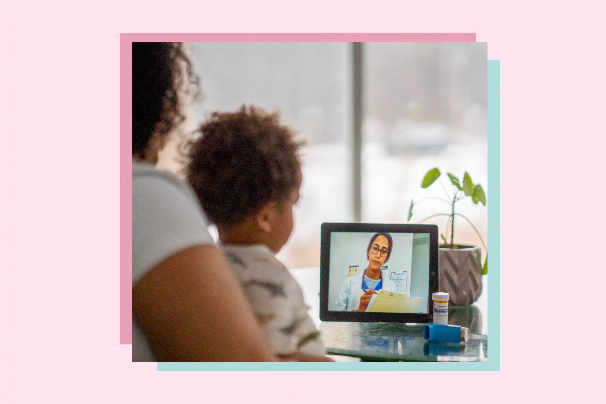 An image of a a woman with her child during a virtual pediatrician visit.