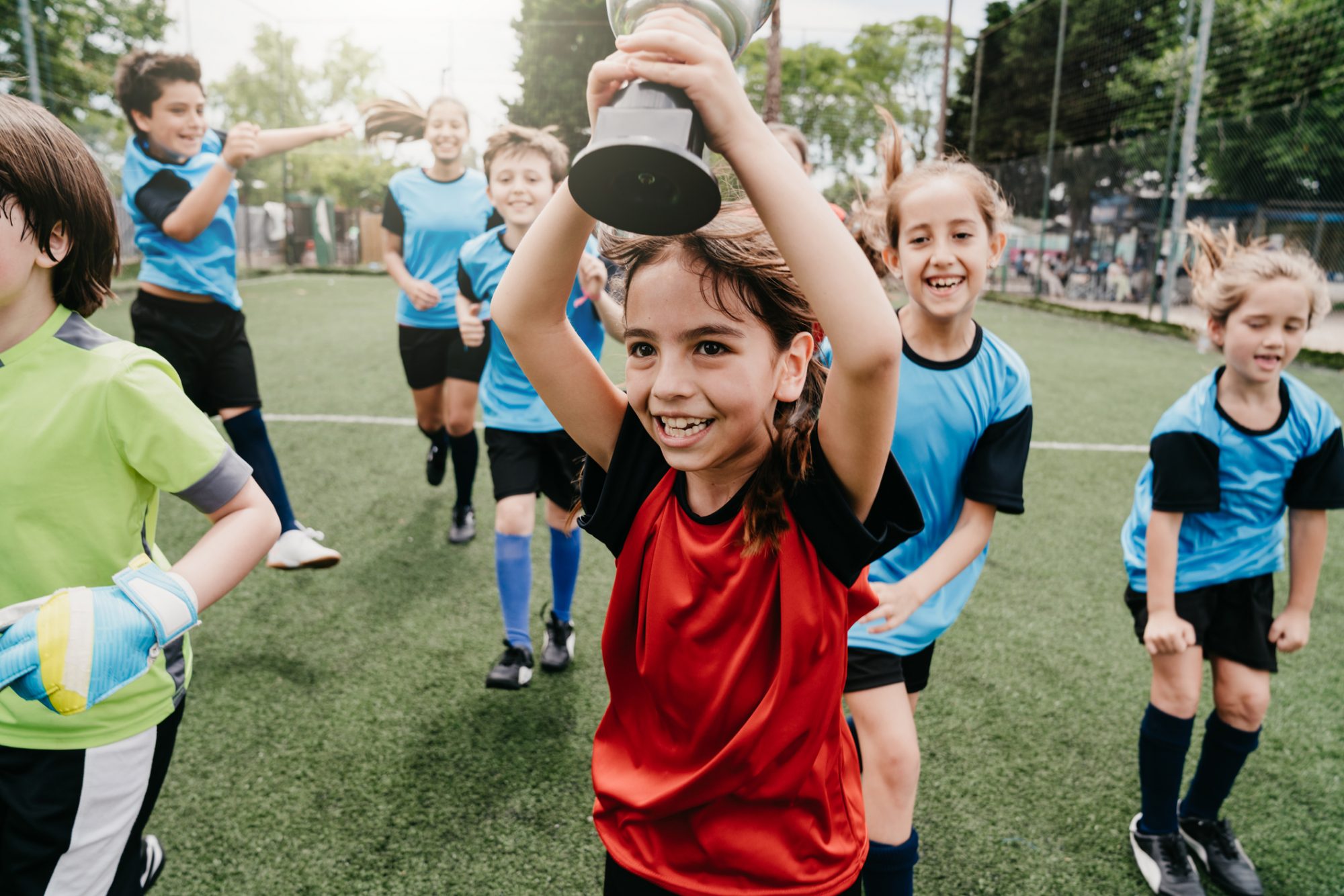 An image of children after a soccer game.