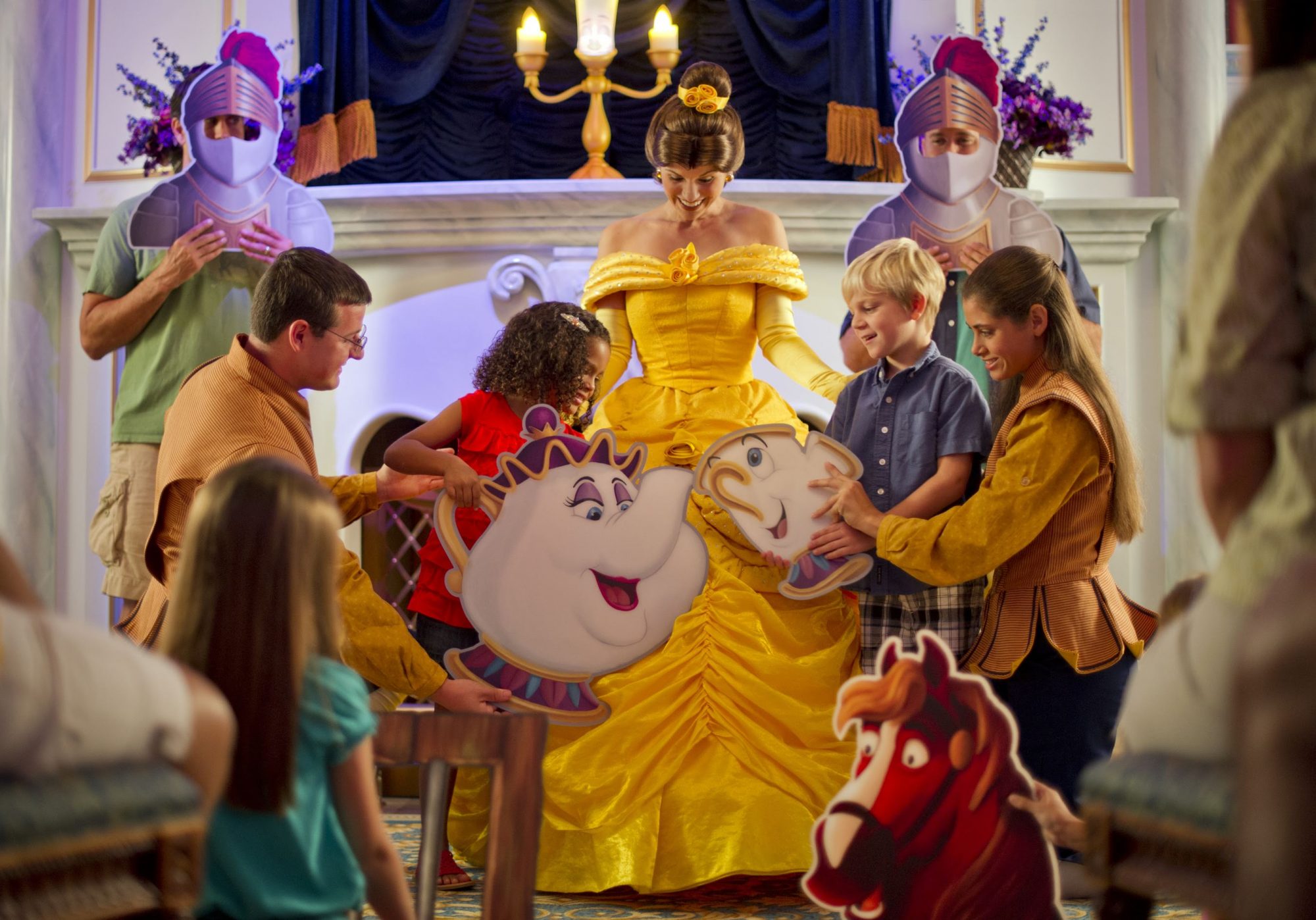 An image of guests in New Fantasyland enjoying 'A Tale as Old as Time' at Enchanted Tales with Belle.