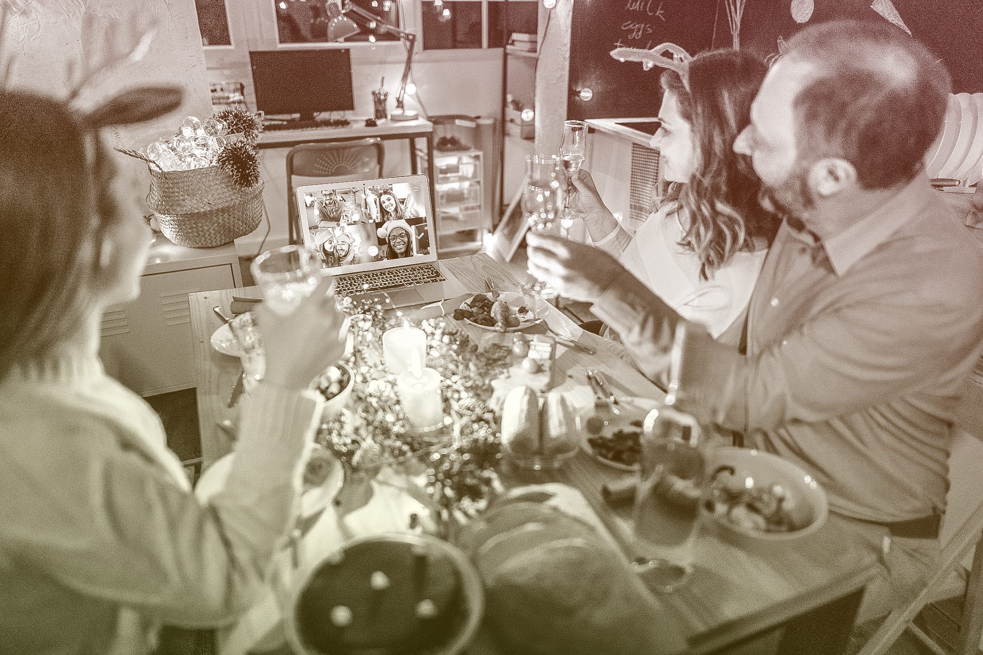 Family toasting on video call with near and dear ones on occasion of Christmas celebration